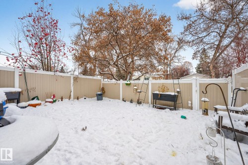 Yard covered in snow with a fenced backyard - 7 Grandview Ridge, St. Albert, AB - Outdoor