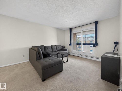 406 2620 Mill Woods Road E, Edmonton, AB - Indoor Photo Showing Living Room