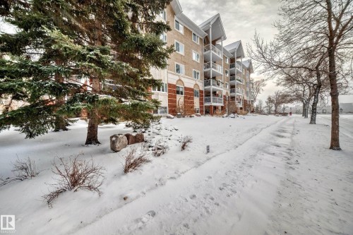 Snow covered property with a view of apartment building / complex - 507 11716 100 Avenue, Edmonton, AB - Outdoor