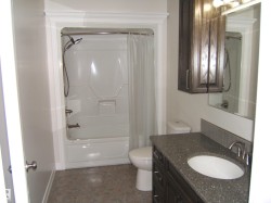 Full bath with shower / tub combo and vanity - 