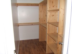 Spacious closet featuring dark wood-type flooring - 