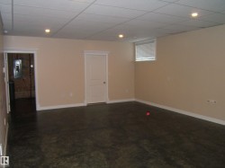 Spare room with a paneled ceiling and recessed lighting - 