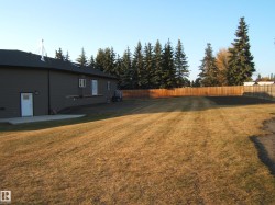 Fenced backyard featuring a patio - 