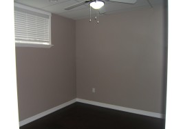 Unfurnished room with a ceiling fan and a drop ceiling - 