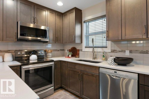 128 Harvest Ridge Drive, Spruce Grove, AB - Indoor Photo Showing Kitchen With Double Sink