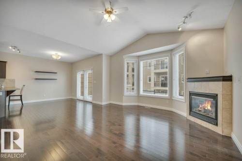 6 Kingdom Place, Leduc, AB - Indoor Photo Showing Living Room With Fireplace