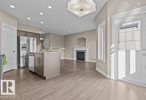 71 Elm Street, Fort Saskatchewan, AB - Indoor Photo Showing Kitchen With Fireplace