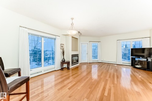 301 11260 153 Avenue, Edmonton, AB - Indoor Photo Showing Living Room With Fireplace