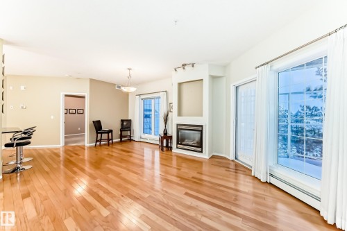 301 11260 153 Avenue, Edmonton, AB - Indoor Photo Showing Other Room With Fireplace