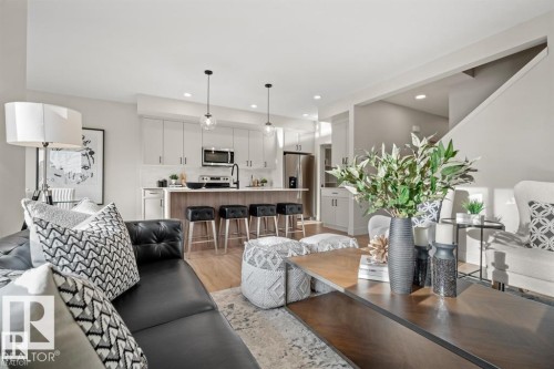 Living area with light wood-style flooring and recessed lighting - 24 Grayson Green, Stony Plain, AB - Indoor Photo Showing Living Room