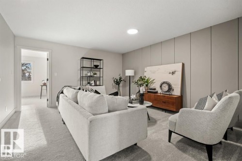 Living room featuring light colored carpet and recessed lighting - 24 Grayson Green, Stony Plain, AB - Indoor Photo Showing Living Room
