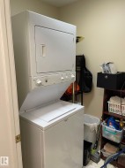 Washroom with stacked washer and clothes dryer - 