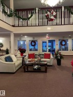 Community lobby featuring a towering ceiling - 