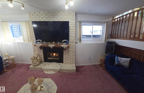 16815 91 Street, Edmonton, AB - Indoor Photo Showing Living Room With Fireplace