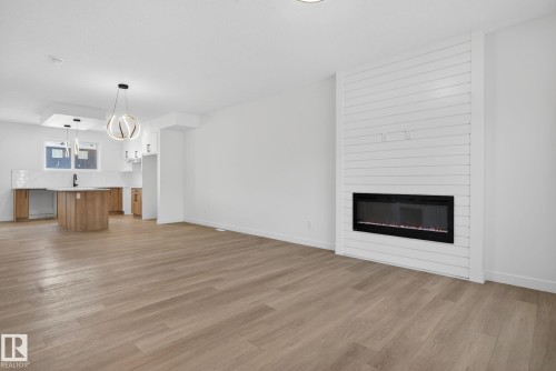 124 Pierwyck Loop, Spruce Grove, AB - Indoor Photo Showing Living Room With Fireplace