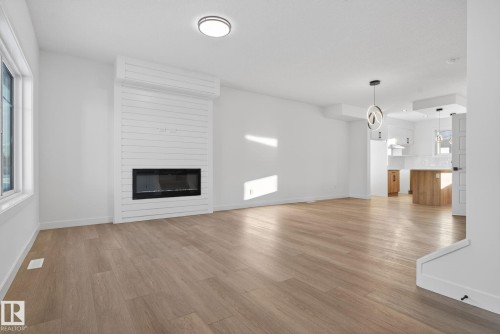 128 Pierwyck Loop, Spruce Grove, AB - Indoor Photo Showing Living Room With Fireplace