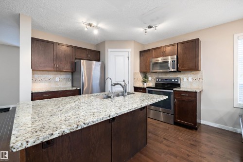 5247 20 Avenue Sw, Edmonton, AB - Indoor Photo Showing Kitchen With Stainless Steel Kitchen With Double Sink