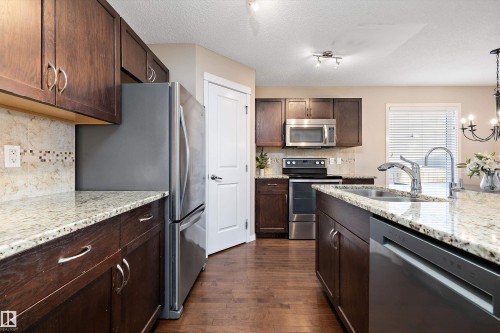 5247 20 Avenue Sw, Edmonton, AB - Indoor Photo Showing Kitchen With Stainless Steel Kitchen With Double Sink With Upgraded Kitchen