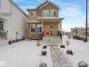 View of front of house with stone siding and covered porch - 4447 Kinsella Green, Edmonton, AB  - Outdoor 