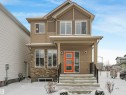 View of front of property with stone siding and covered porch - 4447 Kinsella Green, Edmonton, AB  - Outdoor 