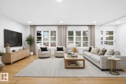 Living room featuring recessed lighting, wood finished floors, and plenty of natural light - 