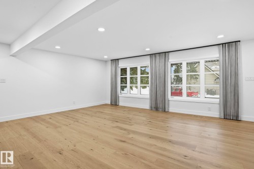 Empty room with light wood-style flooring and recessed lighting - 14604 Mackenzie Drive, Edmonton, AB - Indoor Photo Showing Other Room