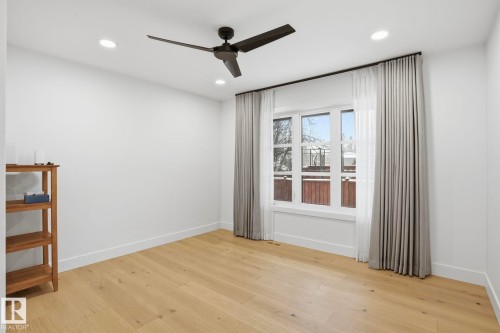 Unfurnished room featuring light wood-type flooring, ceiling fan, and recessed lighting - 14604 Mackenzie Drive, Edmonton, AB - Indoor Photo Showing Other Room