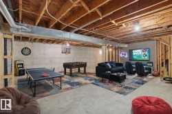 Game room with concrete floors and heating unit - 