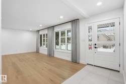 Foyer featuring light wood finished floors and recessed lighting - 