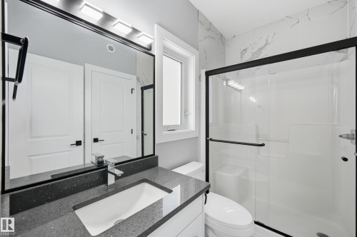 Bathroom with vanity and a stall shower - 829 Morris Avenue, Leduc, AB - Indoor Photo Showing Bathroom
