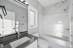 Full bathroom with vanity and bathing tub / shower combination - 