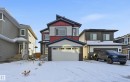 Craftsman inspired home with board and batten siding, stone siding, and a garage - 829 Morris Avenue, Leduc, AB  - Outdoor With Facade 