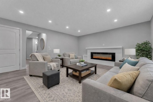 3415 25 Street, Edmonton, AB - Indoor Photo Showing Living Room With Fireplace