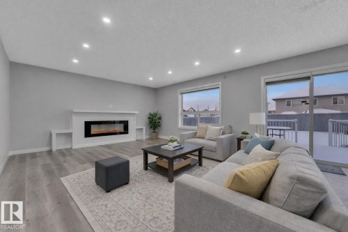 3415 25 Street, Edmonton, AB - Indoor Photo Showing Living Room With Fireplace