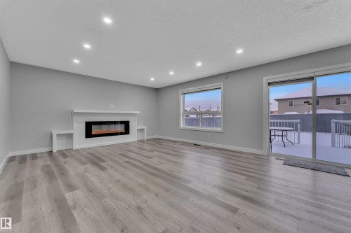 3415 25 Street, Edmonton, AB - Indoor Photo Showing Living Room With Fireplace