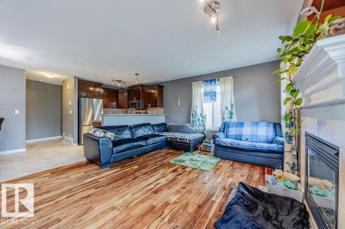 42 9511 102 Avenue, Morinville, AB - Indoor Photo Showing Living Room With Fireplace