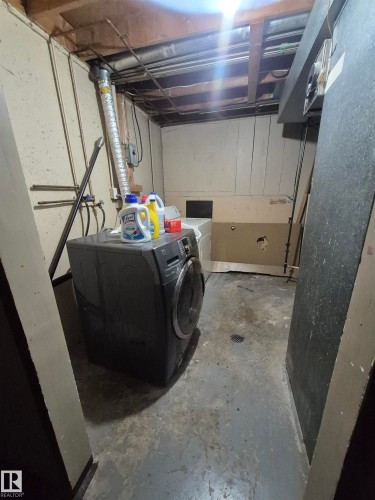 Washroom with unfinished concrete flooring and separate washer and dryer - 4 Amberly Crest, Edmonton, AB - Indoor Photo Showing Laundry Room