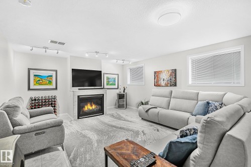 1035 Macewan Close, Edmonton, AB - Indoor Photo Showing Living Room With Fireplace