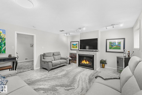 1035 Macewan Close, Edmonton, AB - Indoor Photo Showing Living Room With Fireplace