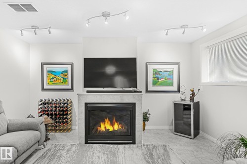 1035 Macewan Close, Edmonton, AB - Indoor Photo Showing Living Room With Fireplace