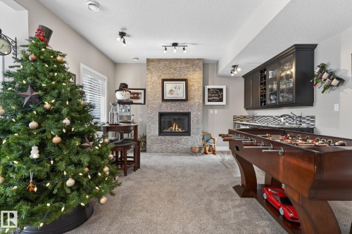 53 Dragonfly Point, Fort Saskatchewan, AB - Indoor Photo Showing Other Room With Fireplace