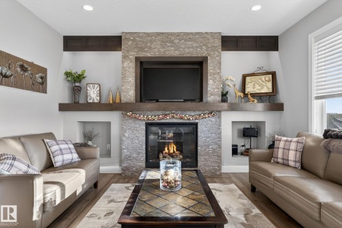 53 Dragonfly Point, Fort Saskatchewan, AB - Indoor Photo Showing Living Room With Fireplace