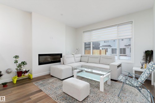 3543 Erlanger Link, Edmonton, AB - Indoor Photo Showing Living Room With Fireplace