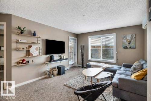 214 12045 22 Avenue, Edmonton, AB - Indoor Photo Showing Living Room