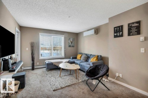 214 12045 22 Avenue, Edmonton, AB - Indoor Photo Showing Living Room