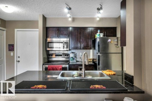 214 12045 22 Avenue, Edmonton, AB - Indoor Photo Showing Kitchen With Double Sink With Upgraded Kitchen