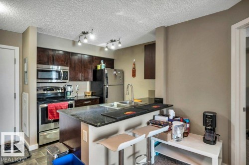 214 12045 22 Avenue, Edmonton, AB - Indoor Photo Showing Kitchen With Double Sink