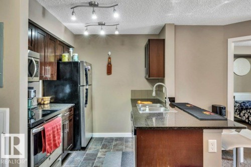 214 12045 22 Avenue, Edmonton, AB - Indoor Photo Showing Kitchen With Double Sink
