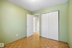 Unfurnished bedroom featuring a textured ceiling and a closet - 