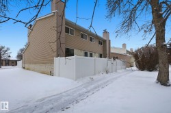 View of snow covered exterior with a chimney - 
